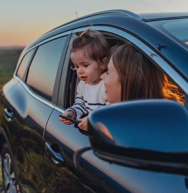 people leaning out car window